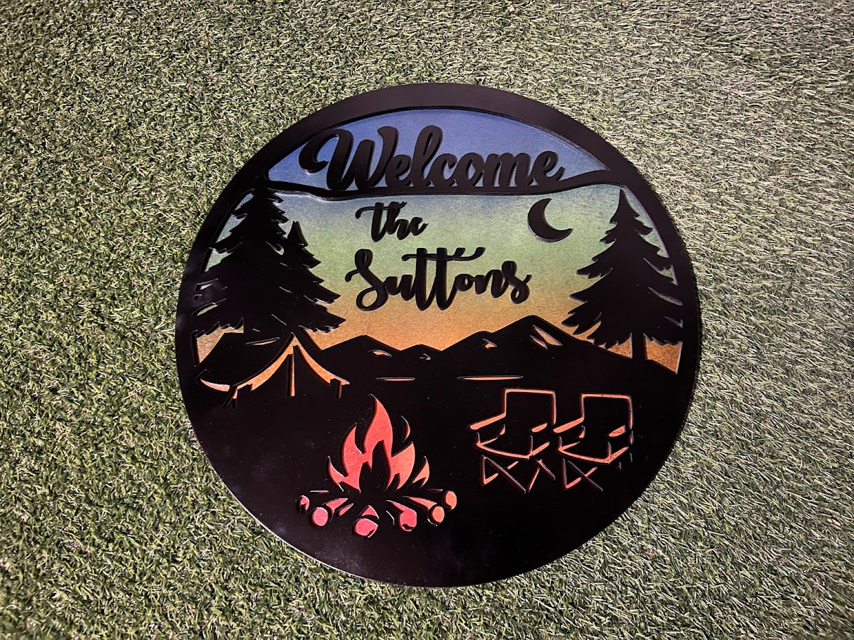 Personalized metal sign with camping design and 'Welcome' text on a textured surface.