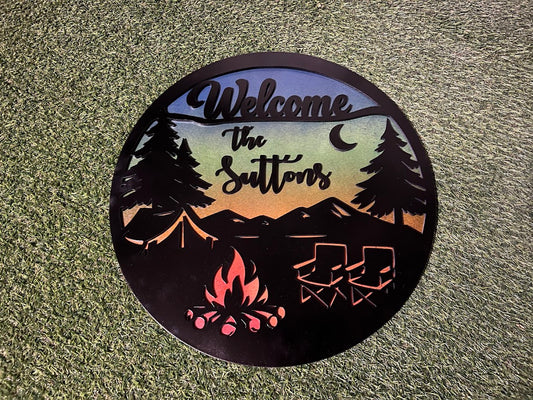 Personalized metal sign with camping design and 'Welcome' text on a textured surface.